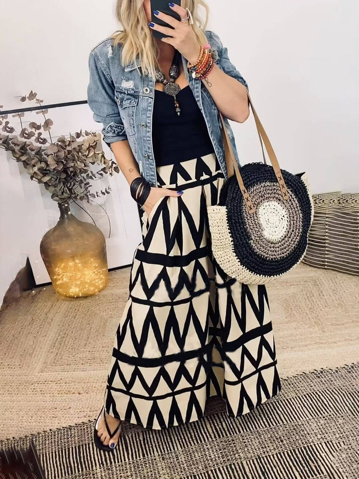 Saia maxi com bolso elástico na cintura traseira com estampa triangular