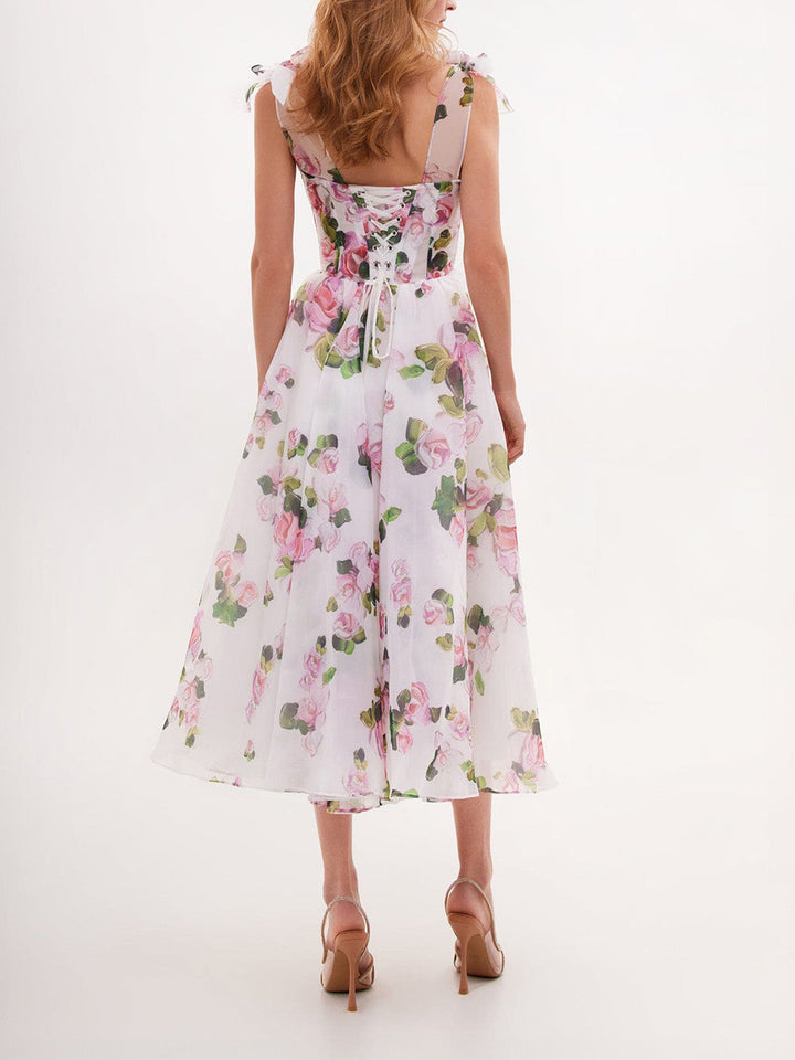 Vestido midi con tirantes anudados y estampado floral delicado